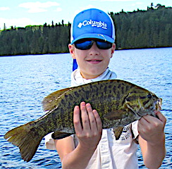 Tyler With His 1st Ever Trophy Smallmouth Bass Fishing at Fireside Lodge in Canada
